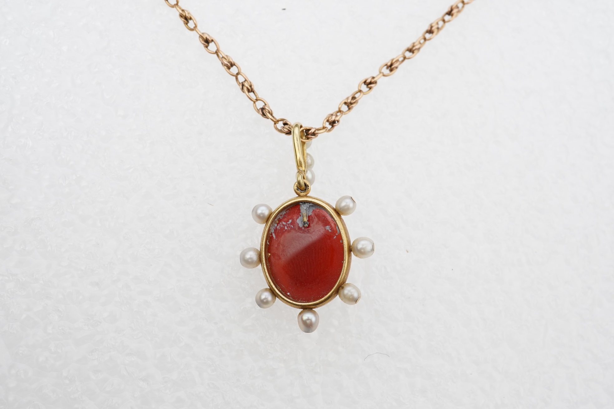 A late Victorian hardstone cameo and pearl pendant, late 19th century